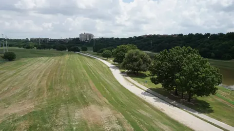 A paved section of the Trinity Trails along the river levee in Fort Worth