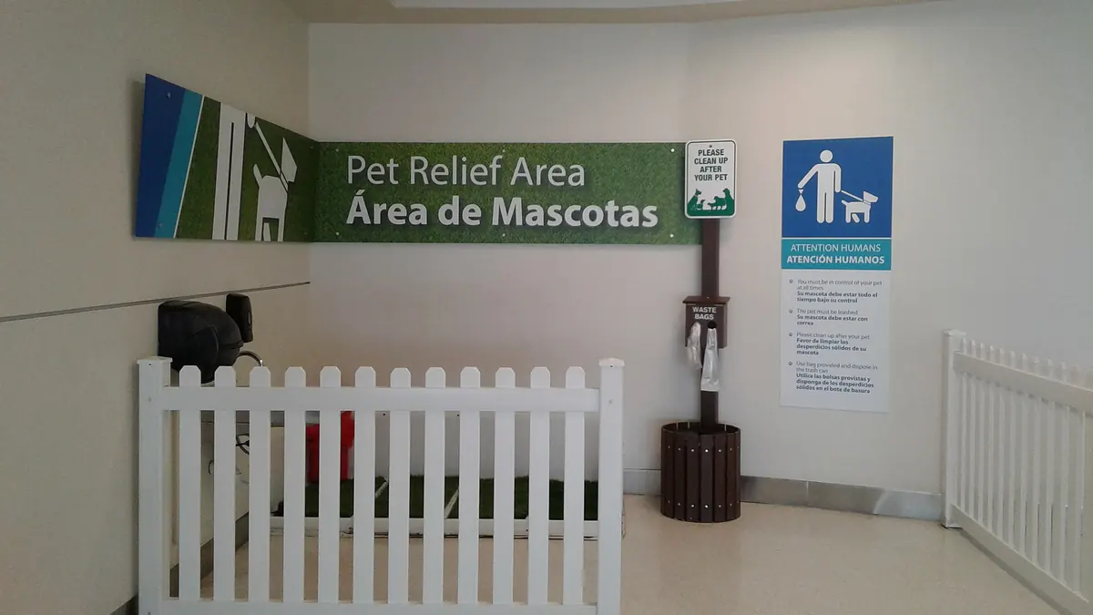 A fenced pet relief area inside Luis Munoz Marin International Airport